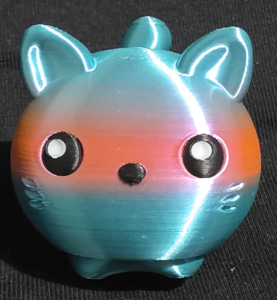 Clicker fidget, teal, orange and pink face