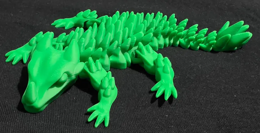 Articulated dragon, gold, close up