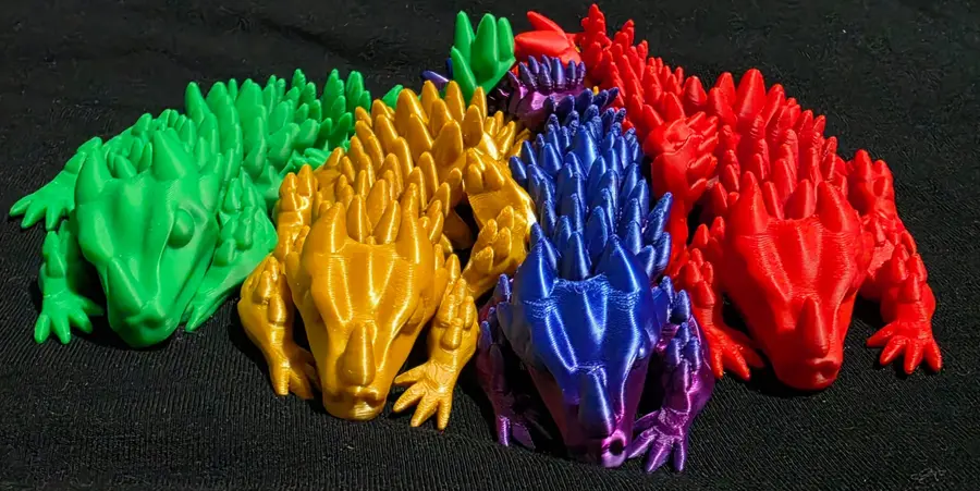 Articulated dragons, red, gold, green and purple/blue together
