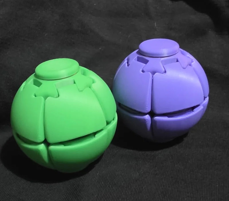 Fidget spinner ball, green and purple, together