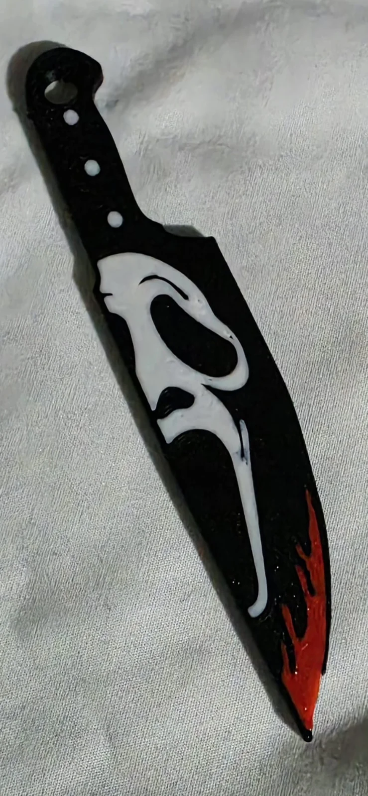 Ghost design knife keyring with red blade tip