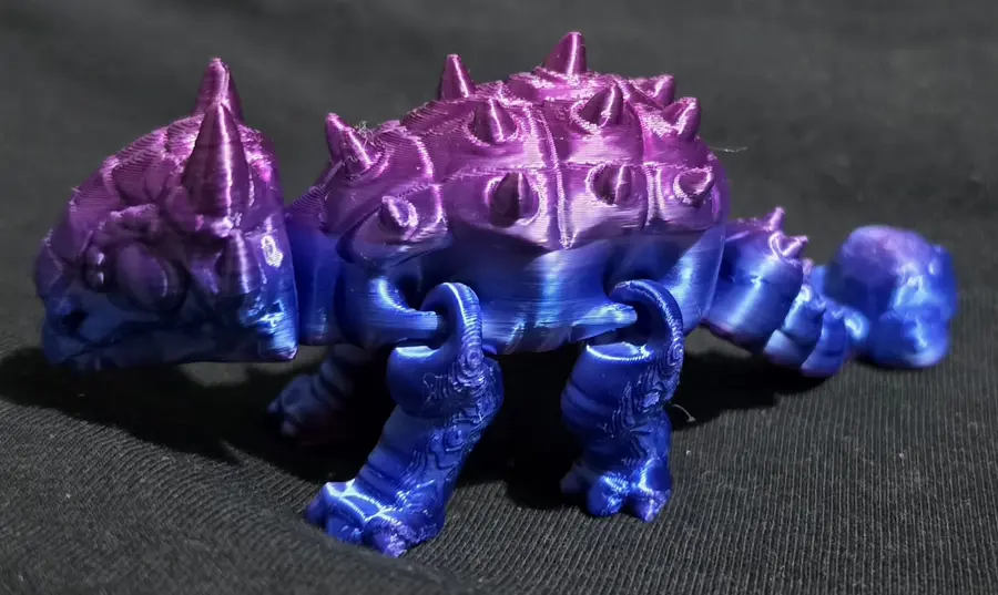Small ankylosaurus, pink/gold and blue/purple together
