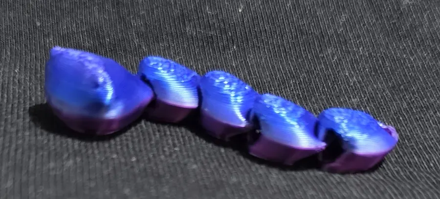 Wiggly worm fidget, blue and purple shimmer, close up